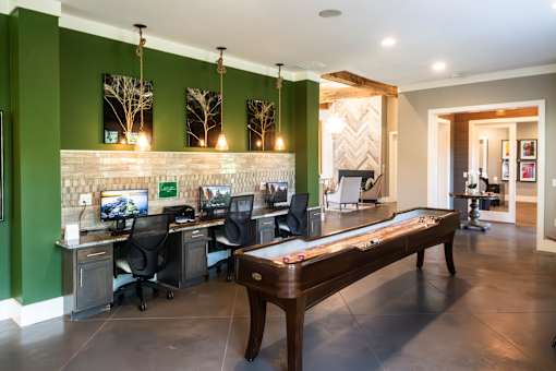 A room with green walls and a long wooden bench.