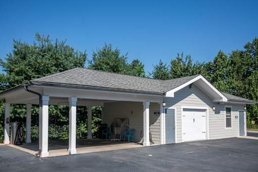 A two-story garage with a covered porch.