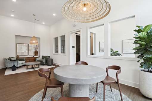 A modern dining room with a round table and chairs at Arcadia Cartersville Apartments, Cartersville, 30121