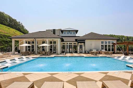 A large house with a pool in front at Arcadia Cartersville Apartments, Cartersville, Georgia