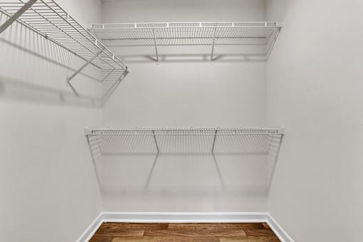 Empty white closet at Bridgewater Apartments, Duluth, GA