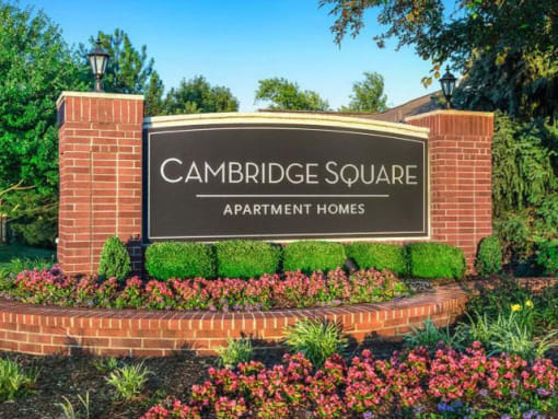 Lush landscaping surrounds you as you drive at Cambridge Square Apartments, Overland Park, KS 66211