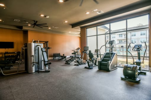 the gym at the district flats apartments in lenexa