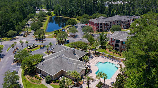 Aerial view of property with clubhouse and pool at Courtney Bend Apartments, Hardeeville, 29927