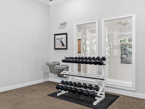 Free weight rack and water station in fitness room at Courtney Bend Apartments, Hardeeville, 29927