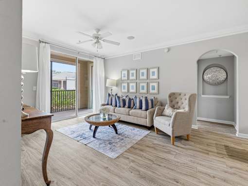 Living room with balcony and modern finishes at Courtney Bend Apartments, South Carolina, 29927