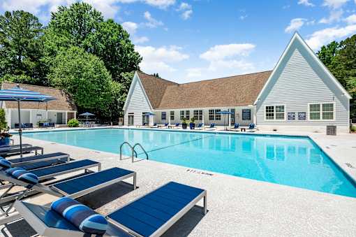 A pool with sun loungers at Dunwoody Glen, Atlanta, GA 30360
