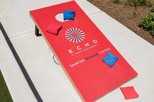 Enjoy a Game of Corn Hole with Friends at Echo at North Pointe Center Apartment Homes, Alpharetta, GA 30009