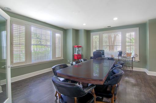 A dining room with a table and chairs at Enclave at Wolfchase Apartments, Memphis, TN 38016