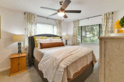 a bedroom with a bed and a ceiling fan at 1900 Rosemont, Roswell, 30076