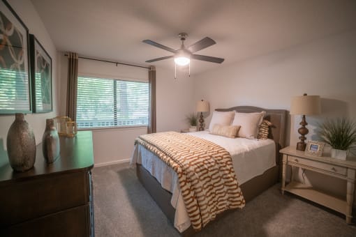 a bedroom with a large bed and a ceiling fan at 1900 Rosemont, Roswell