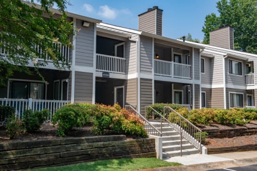 an apartment building with stairs and balconies