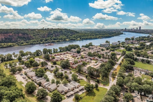 an aerial view of a city with a river and trees at Brightwaters Apartments, Little Rock, Arkansas