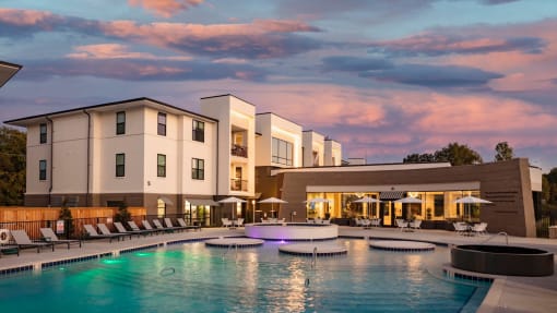 a large swimming pool in front of a hotel at Esplanade District Apartments, Arkansas