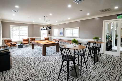 Room with tables and chairs at The Fenwick Apartment Homes, Texas, 77396