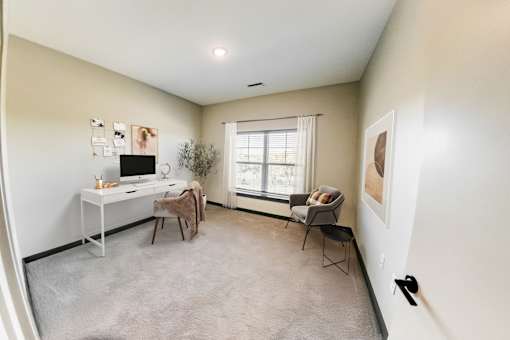 A room with a desk, chair, and a window at Harbor Side at Conwood Flats Apartments, Memphis, Tennessee