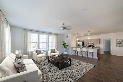 A living room with a white couch and a coffee table.