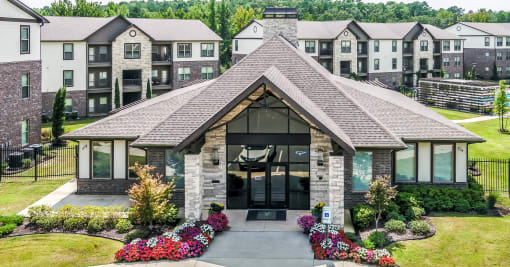the front of a building with apartments in the background