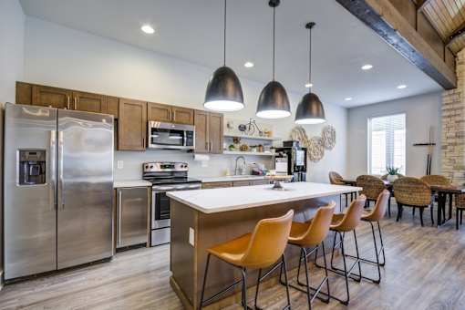 Fitted Kitchen With Island Dining at McKenzie Park Apartments, Little Rock
