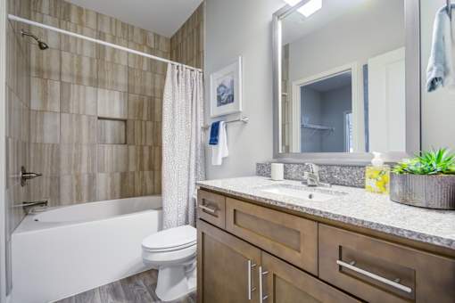 Bathroom with a White Tub at McKenzie Park Apartments, Arkansas