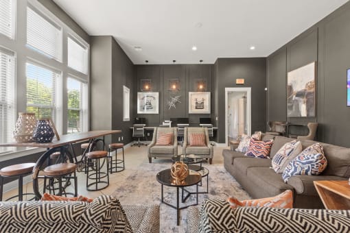 a living room with couches and chairs and a dining room table at The Ridge at Chenal Valley, Little Rock