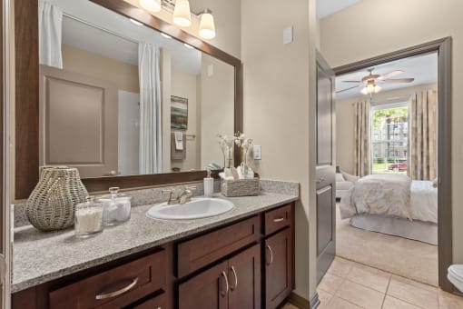 a bathroom with a sink and a mirror at The Ridge at Chenal Valley, Arkansas, 72223