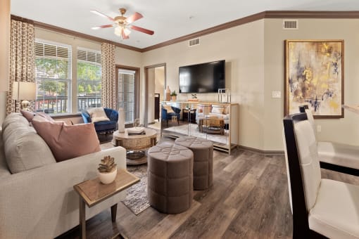 a living room with a couch and a tv at The Ridge at Chenal Valley, Little Rock, Arkansas