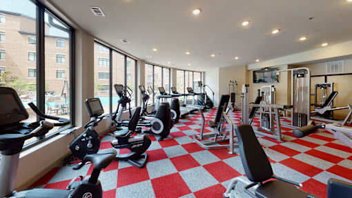A gym with a red and white checkered floor.