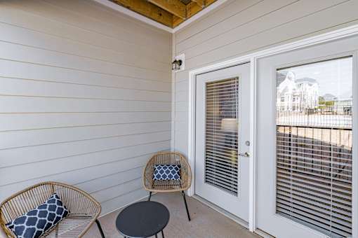Patio with a chair and a table at The One at Spartanburg, Spartanburg, SC, 29303