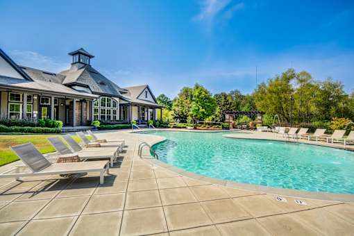 Sun loungers by the pool at The Ridge at Chenal Valley Apartments, Arkansas