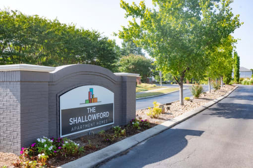 the sign for the shallows at the entrance to the subdivision with trees at The Shallowford, Chattanooga, TN