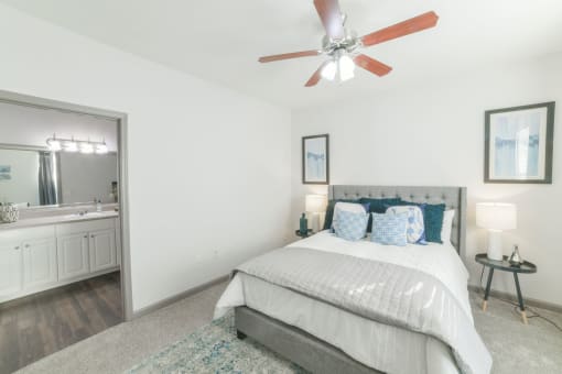 a bedroom with a bed and a ceiling fan at The Shallowford, Chattanooga, Tennessee
