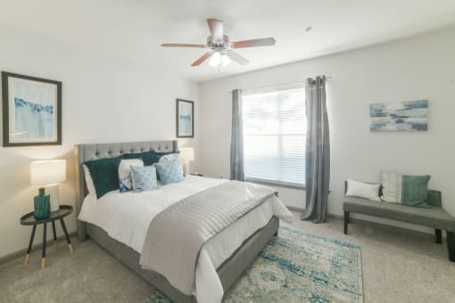 a bedroom with a bed and a ceiling fan at The Shallowford, Chattanooga, Tennessee