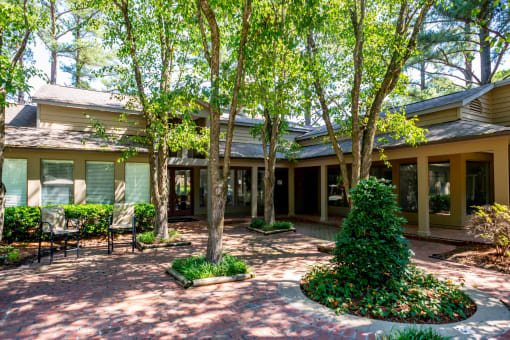 the front of a house with trees and a courtyard at The Summit Apartments, Tennessee
