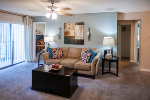 a living room with a couch and a coffee table at The Summit Apartments, Memphis, TN, 38128
