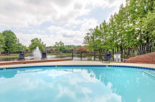 the swimming pool at the resort has a fenced in pool at The Waters at Chenal, Little Rock, AR 72211
