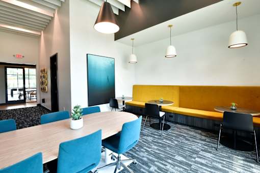 A coworking room with ample seating space and a beautiful design