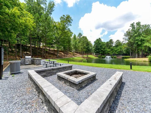 Gathering Area With Grills And Corn Hole at St. Andrews Apartment Homes, Johns Creek