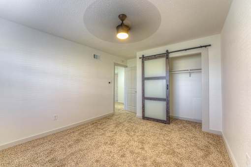  Bedroom with Closet Barn Door at The Garden District Apartments, Germantown, TN  