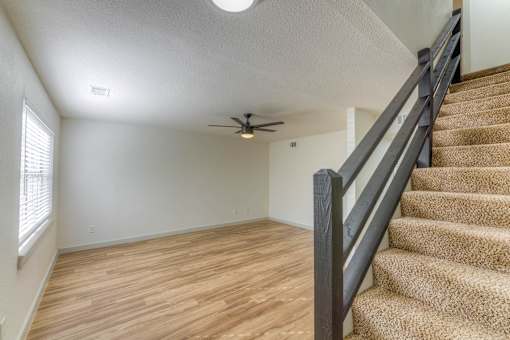 Living Room Stairs at The Garden District Apartments, Germantown, 38138  