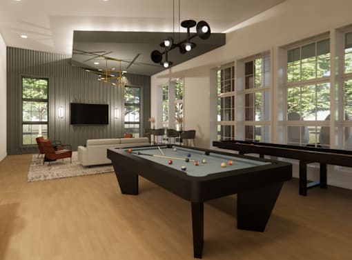 A billiard table is in the middle of a room with a television and a couch at Grays Creek Apartments, Cordova
