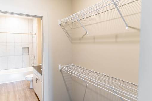 A white empty pantry with a toilet in the corner at Harbor Side at Conwood Flats Apartments in Uptown Memphis, TN