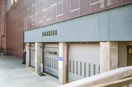 A parking garage with a sign that says at Harbor Side at Conwood Flats Apartments, Memphis, TN, 38107