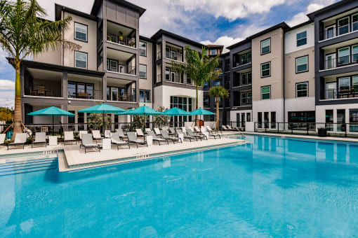 Swimming Pool With Relaxing Sundecks at Harrison Apartments, Florida