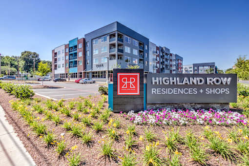 A sign for Highland Row Residences and Shops is in front of a building at Highland Row Apartments, Memphis, TN,  38111