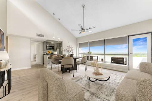 A living room with a large window overlooking the beach.at Iris Luxury Apartments, Memphis, TN 38105  