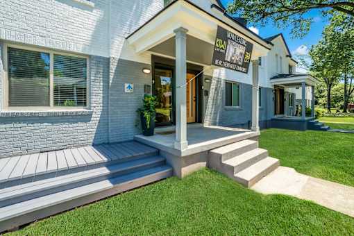the entrance to a building with grass and a sidewalk at Kiwi Goji Apartments, Memphis, 38111