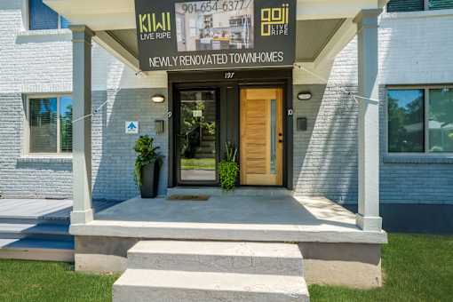 A house with a sign that says at Kiwi Goji Apartments, Memphis