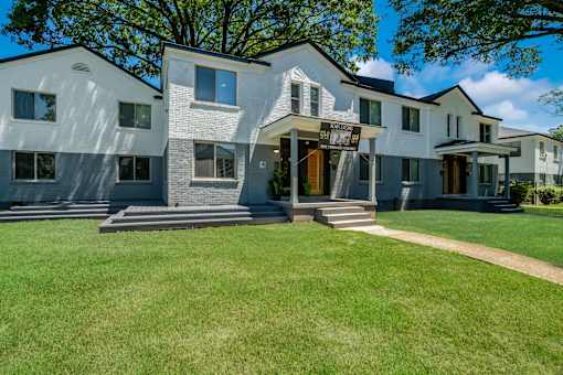 A modern two-story house with a large front yard at Kiwi Goji Apartments, Memphis, 38111