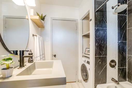 a bathroom sink that is modern and gray in color at Kiwi Goji Apartments, Tennessee